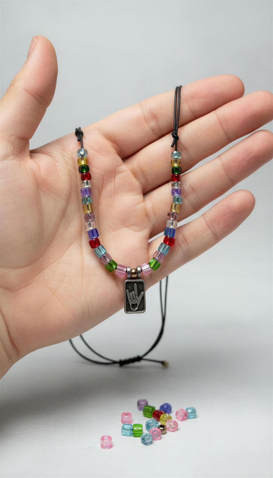 Pewter pendant featuring a hand  ILY in American Sign Language