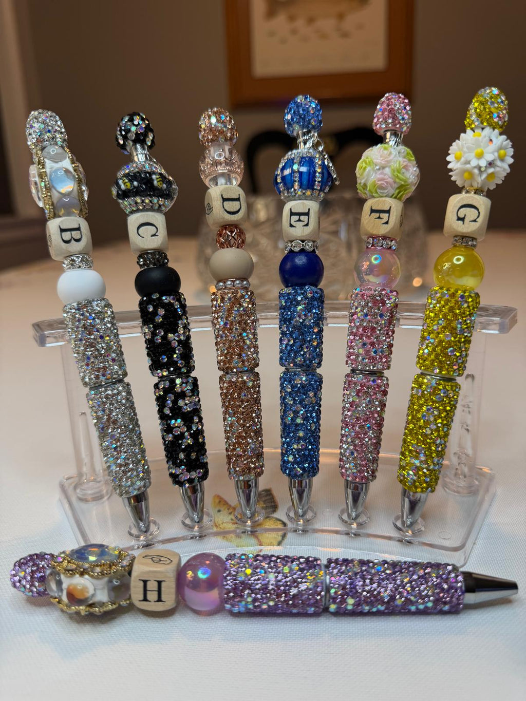 Elegant pens featuring luxurious stones, arranged in the alphabet