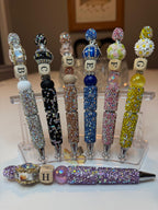 Elegant pens featuring luxurious stones, arranged in the alphabet