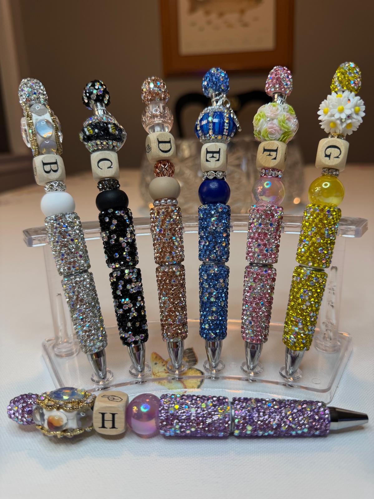 Elegant pens featuring luxurious stones, arranged in the alphabet